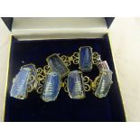 A glass pagoda cut bracelet, set with seven intaglio carved pagodas iridescent glass gem,