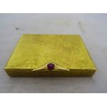 Cartier London: a 9ct powder compact set with cabochon ruby circa 1966,