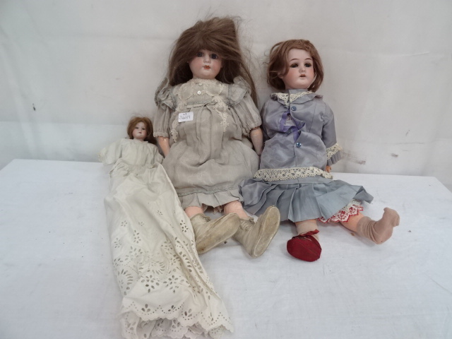Three bisque dolls to inc two German examples in original clothing