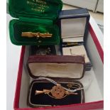 A mixed lot of items comprising a gold Royal Engineer brooch, a bar brooch, a gilt metal brooch,