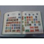 A vintage stamp album of World & GB to include Twopenny Blue,