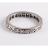 A platinum & diamond eternity ring, set with 23 brilliant cut diamonds,