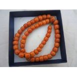 A coral bead necklace and coral clasp, c1920 CONDITION REPORT: total weight 48.