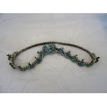 A Navajo necklace by Ed Niiha: turqoise squash blossom design