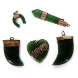 Five 19th Century Maori Nephrite Jade Brooches/Pendants: Comprising two gold set claw pendants,