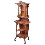 A Chinese hardwood display cabinet, circa 1900: The shaped door enclosing two velvet shelves,