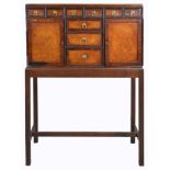 A 19th Century Anglo-Chinese Hardwood Cabinet on Later Stand: The top fitted with nine drawers and