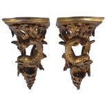 A Pair of 19th Century Giltwood Wall Brackets: the shaped shelves supported on scrolling acanthus