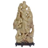A Chinese Soapstone Carving: 19th century Smoothly carved as the female Taoist Immortal He Xiangu