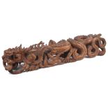 A Large Chinese Wood Carving: 19th century Finely and intricately carved in the shape of a sinuous