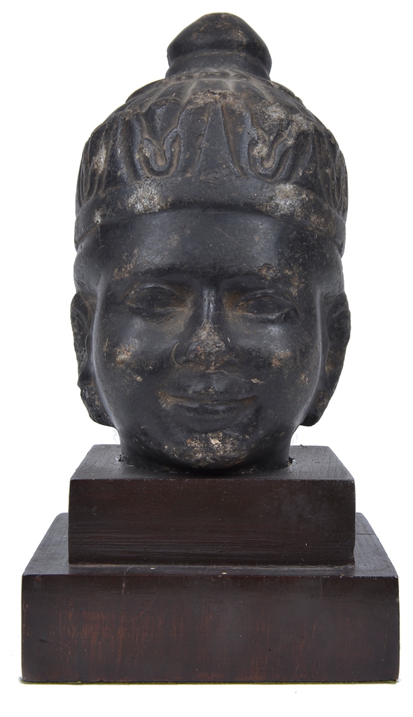An Antique South-East Asian Stoneware Sculpture: Modelled as a Buddha head. On a later wooden base.