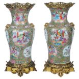 A Pair of Chinese Canton Famille Rose Vases: 19th century Densely decorated with medallions