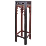 A Large Chinese Red and Black Lacquered Stand: above a frieze carved with stylized lozenges,