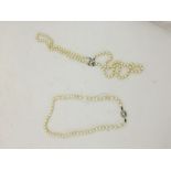 A double strand of cultured pearls;