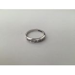 An 18ct Channel diamond set half eternity ring, approx total .