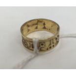 A gold Zodiac sign ring