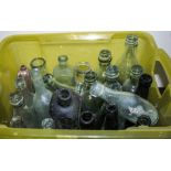 A box containing vintage bottles