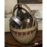 A basket containing vintage bottles and other items