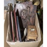 A box containing wooden items and pictures