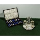 A silver plated cruet together with a cased set of teaspoons