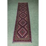 A 100% hand knotted woolen Meshwani runner, 58cm x 258cm