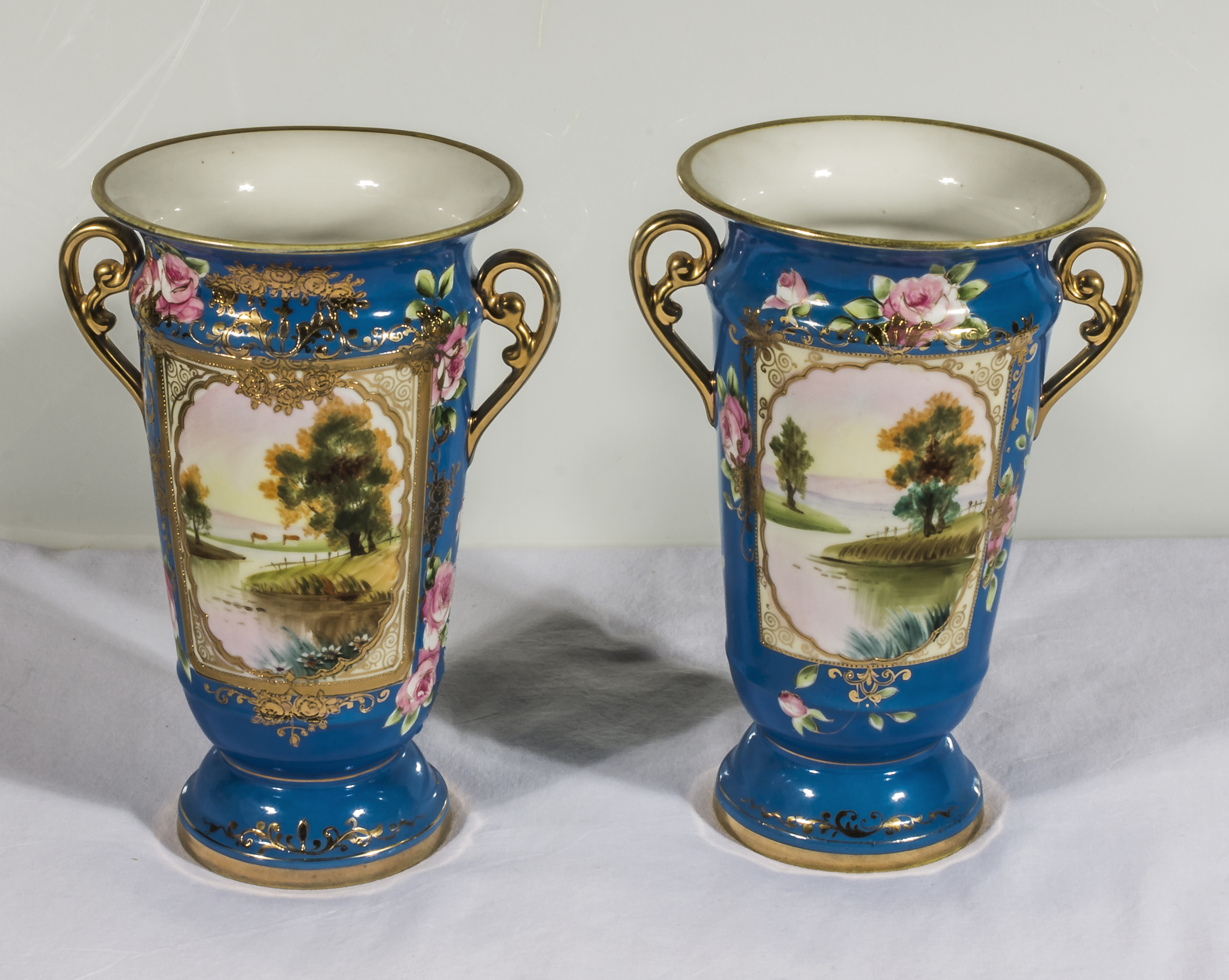 A pair of Noritake twin handled vases