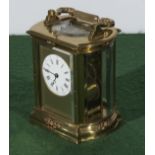 A brass repeater carriage clock