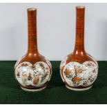 A pair of Kutani bottle vases, 23.5cm high