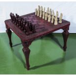 A modern chess set with table.