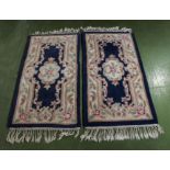 Two Chinese blue ground rugs, 123cm x 61cm