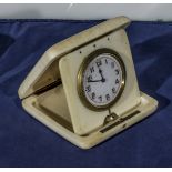 An ivory travel clock