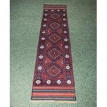 A 100% hand knotted woolen Meshwani runner, 59cm x 255cm