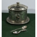 A silver plated biscuit barrel and 2 spoons.