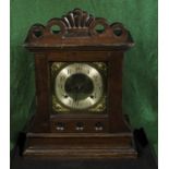 A brass face mantle clock