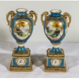 A pair of Noritake twin handled urns