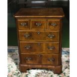 A walnut television cabinet in the style of a chest, size height 97cm x width 70cm x depth 47.5cm