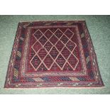 A 100% hand knotted woolen Tribal Gazac rug, 119cm x 121cm