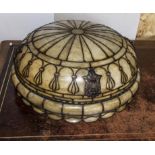 A large vintage glass and brass light shade