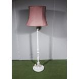A painted standard lamp and shade