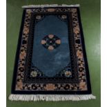 A Chinese blue ground silk rug, 154cm x 91cm