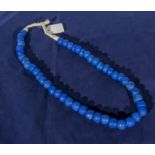 A tribal necklace of blue beads