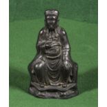 A Ming dynasty bronze figure of a seated emperor, traces of gilding, 16.5cm high