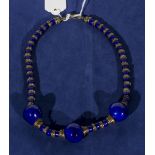 A blue and gilt porcelain necklace