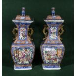 A pair of Chinese Mandarin lidded vases