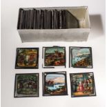 A box containing assorted coloured lantern slides