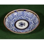 A blue and white Worcester dish with gilt decoration, blue crescent mark to base