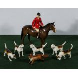 A Beswick Huntsman 1501, a Beswick fox #1440 together with five foxhounds