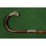 A silver mounted walking cane.