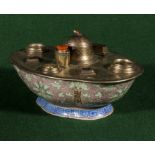 An Oriental pottery bowl inset with a French desk inkwell/pen stand