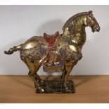 A 20th century Tang horse. 56cm high x 64 cm wide